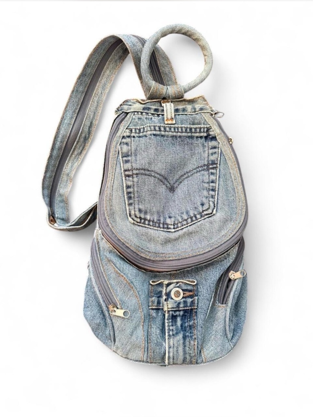 LEVI denim backpack by Hand & Heart. Worn as backpack/sling. Made from Levi’s